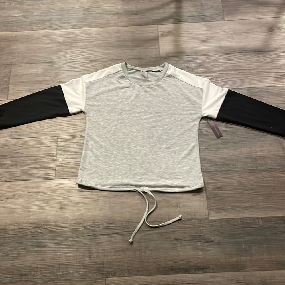 Gray sweatshirt with black and white sleeves.